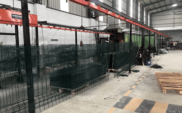 Conveyorized-Auto-Powder-Coating-plant-with-two-conveyor-lines-in-common-Camel-back-oven